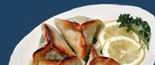 Fatayers: Spiced triangular spinach pie stuffed with meat and pinions.