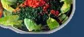 Tabbouleh: Salad made with bulgur wheat and finely chopped scallions, tomatoes, mint, and parsley.